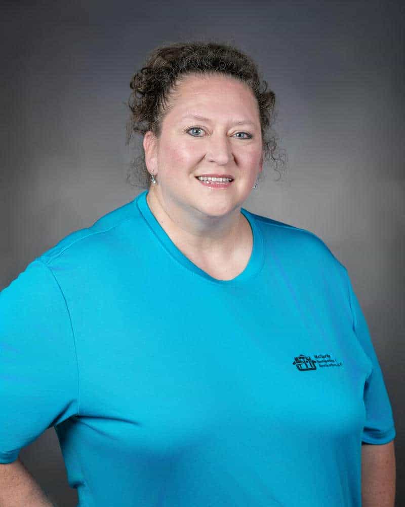 Smiling woman in blue shirt portrait